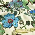 Рогожка соти кремова в коричневі ключі і зелені квіти, ш.150